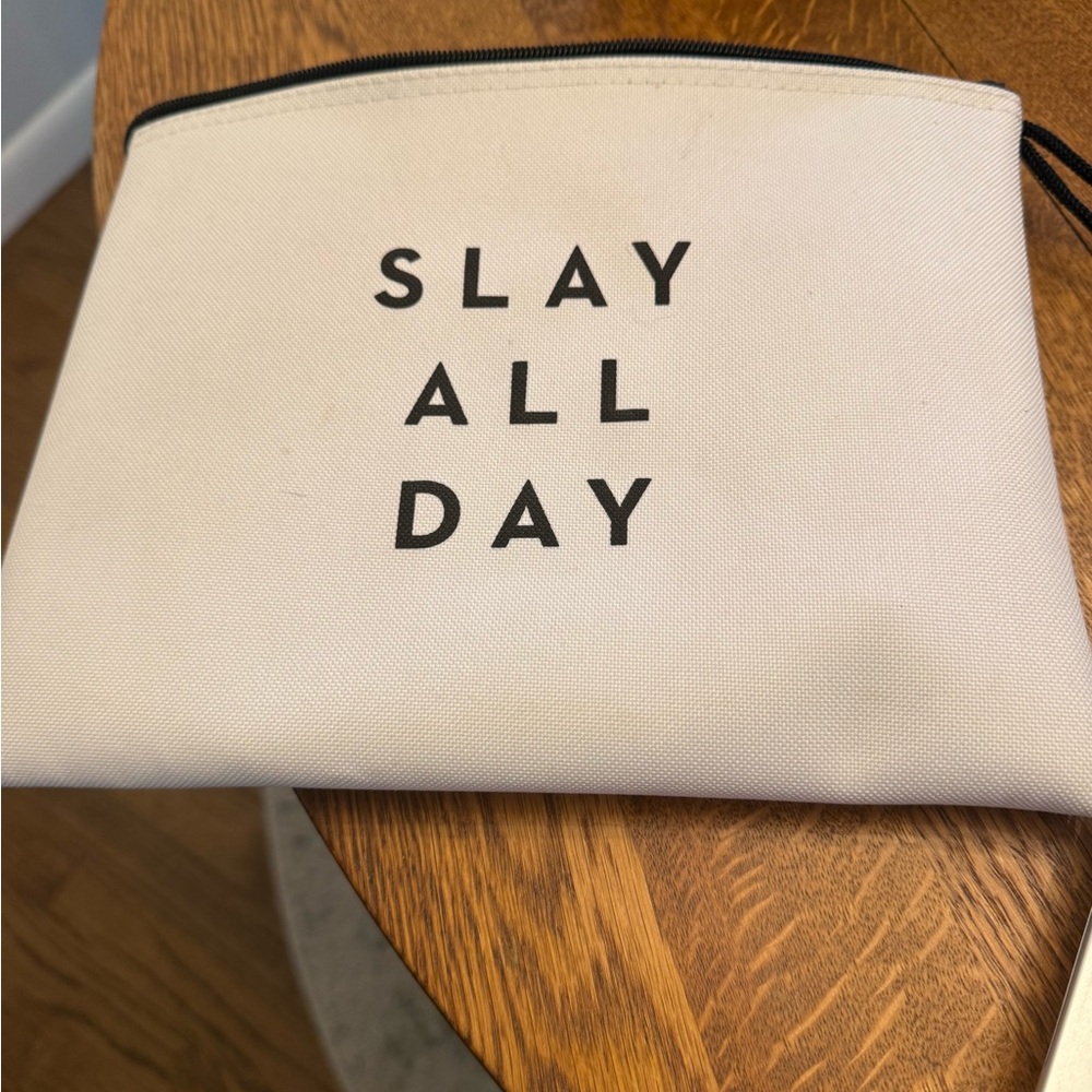 White Pouch with Black Text
